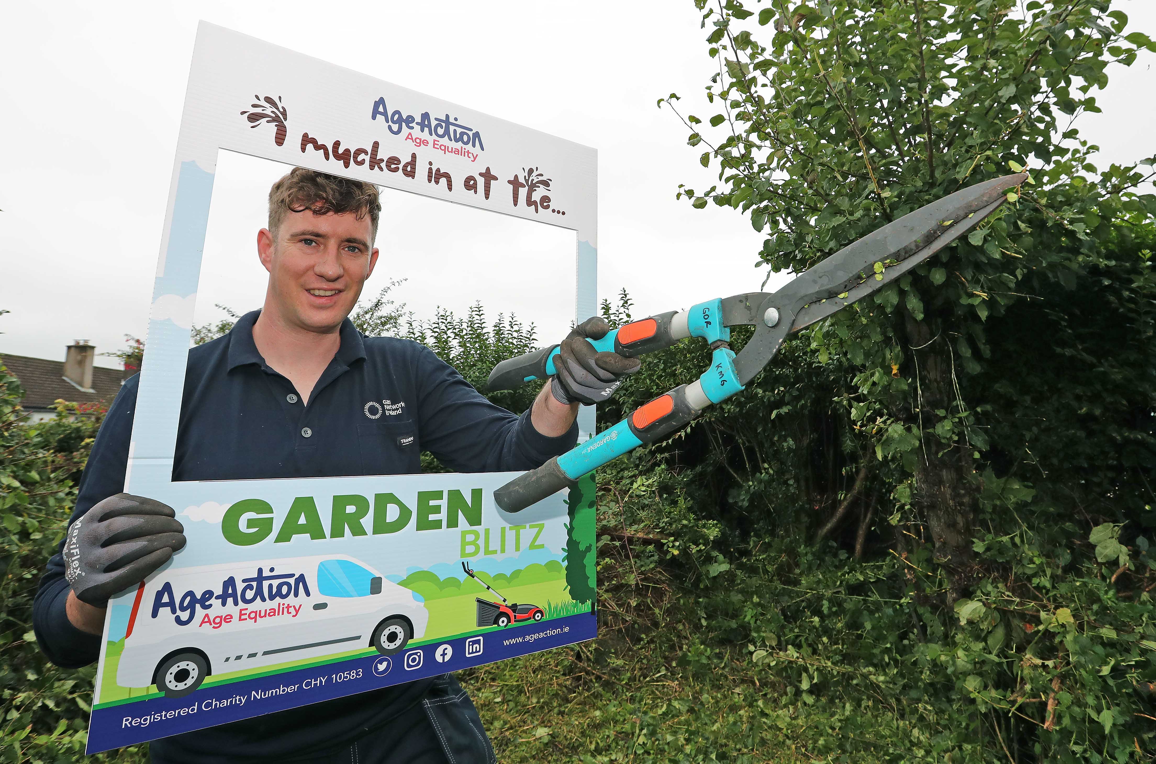 Volunteers tending to an older person's garden 